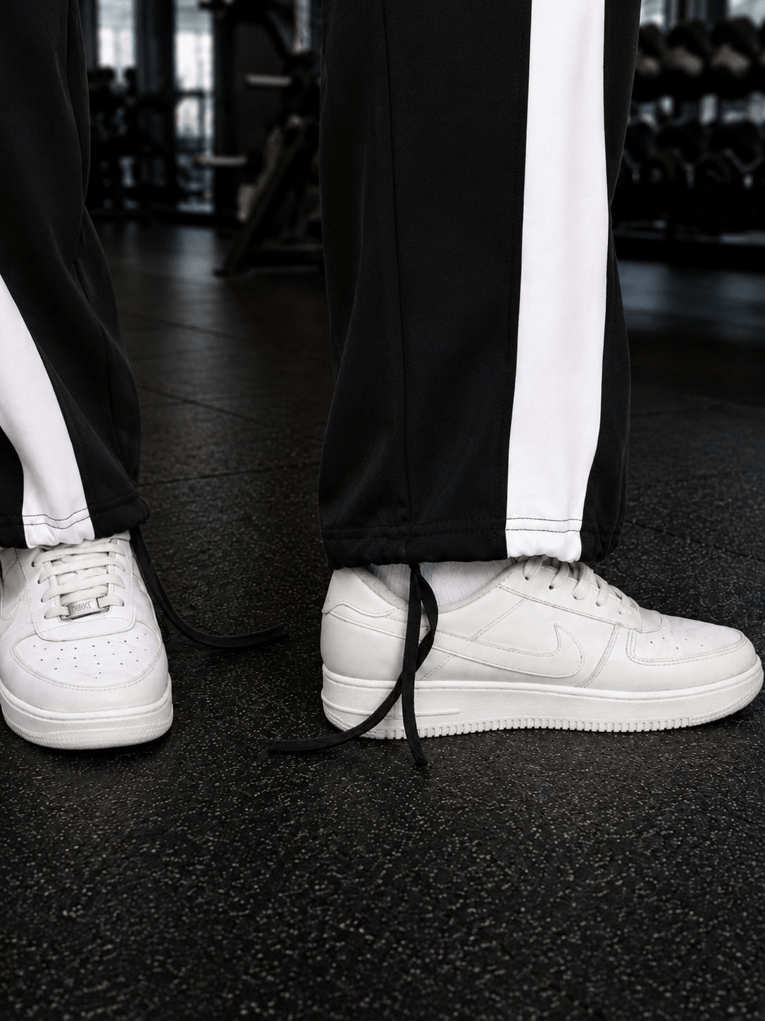 Women Retro Runner Relaxed-Fit Joggers Black styled with white sneakers, showcasing sporty comfort and retro edge.