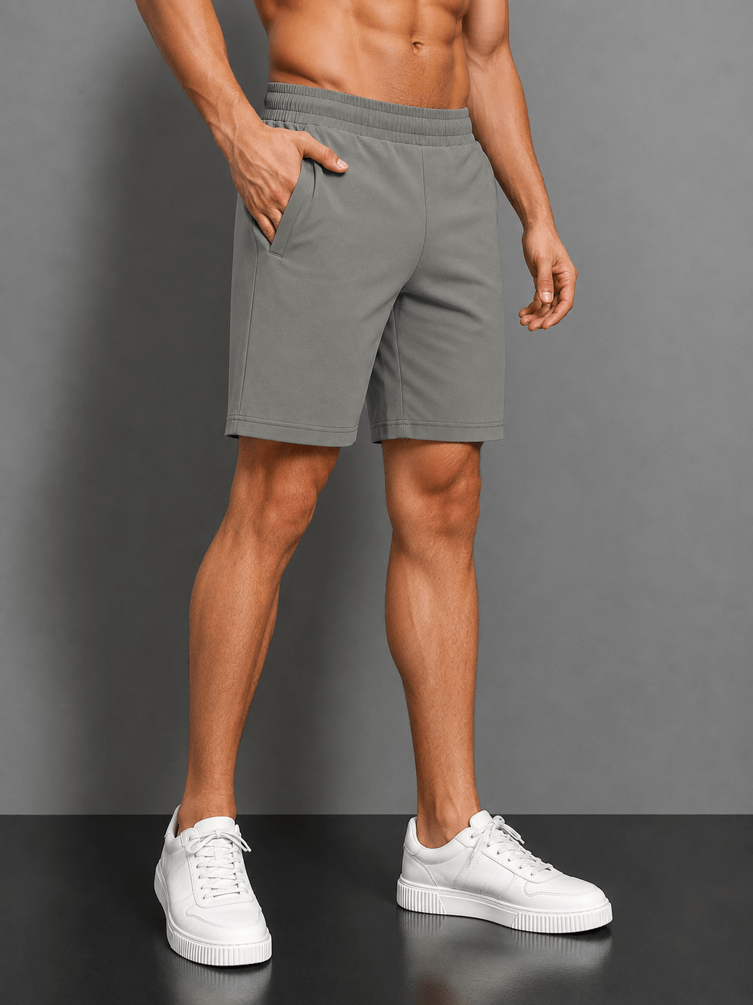 SLIM-FIT SOLID REGULAR SHORTS GREY styled with white sneakers for a modern, polished look.