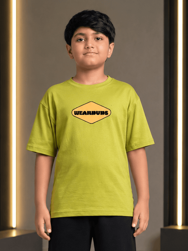 BEAR ON BOARD T-SHIRT FOR BOYS GIRLS OLIVE GREEN worn by a boy, showcasing the playful design and trendy style.