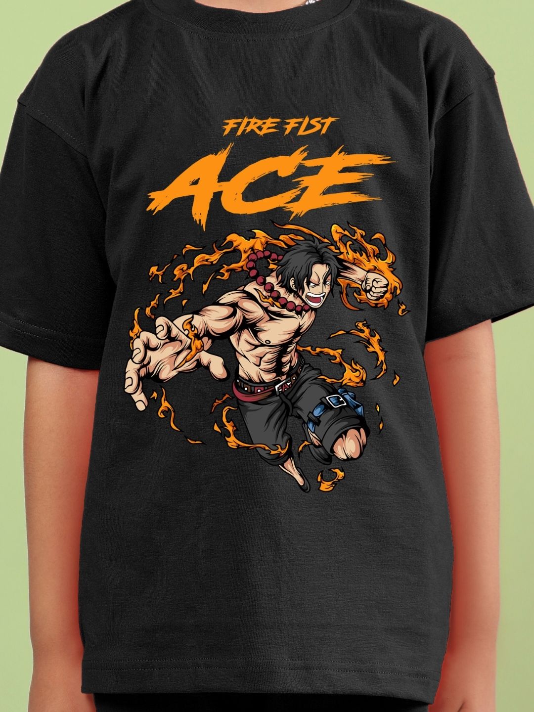 Child wearing black T-shirt with bold 'ACE' and fiery action character graphic design.