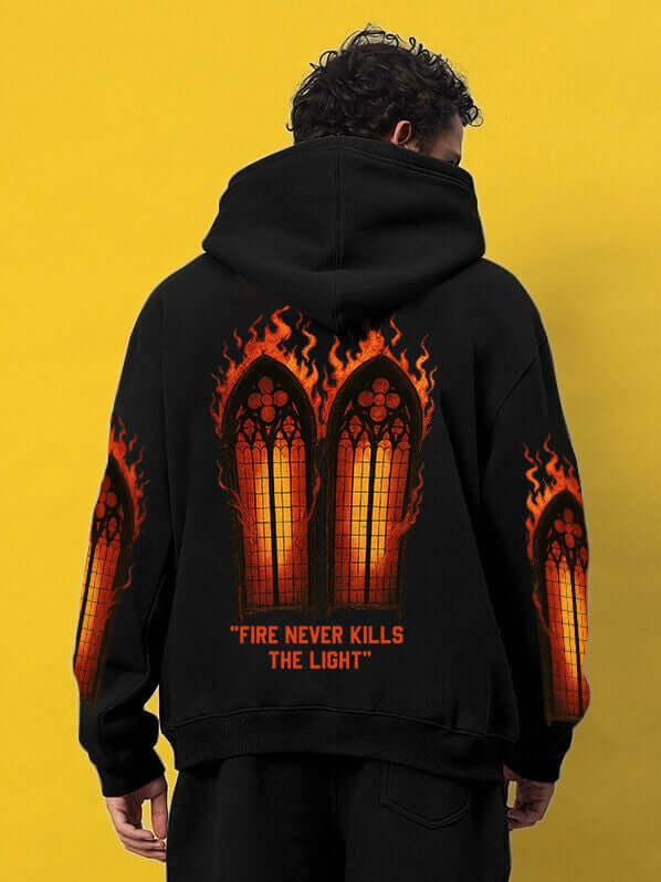FIRE NEVER KILLS THE LIGHT PRINTED FLEECE HOODIE BLACK with fiery graphic design