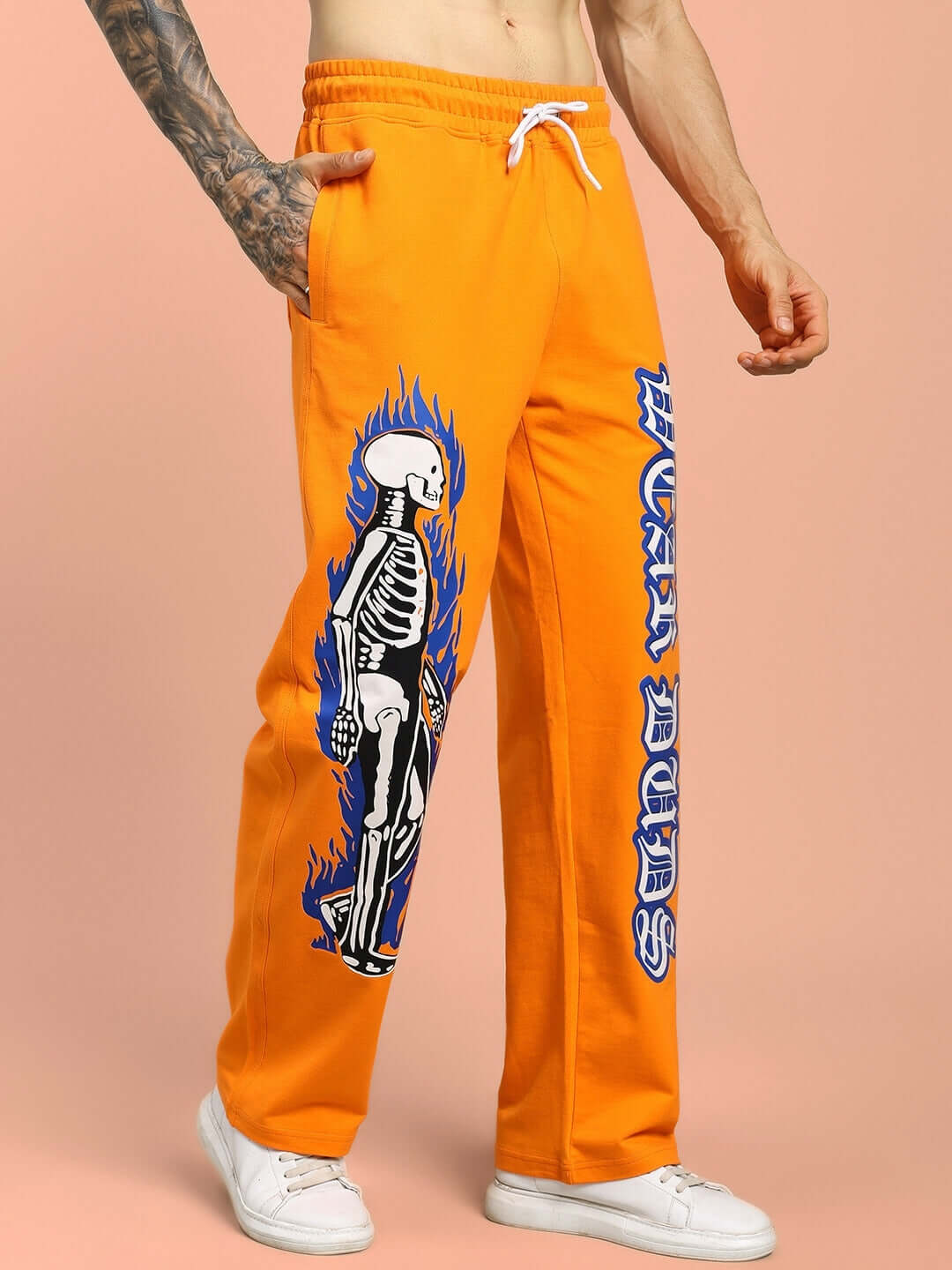 FLAMING SKELETON PRINTED RELAXED FIT JOGGER ORANGE with graphic design