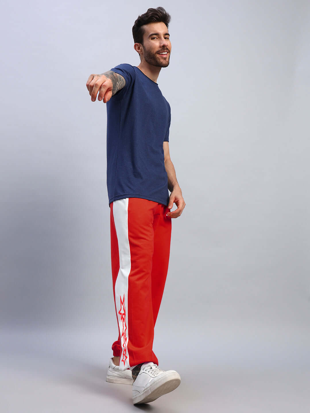 Model wearing Flash Relaxed Fit Joggers in red-white, showcasing custom fit option by DUDS.