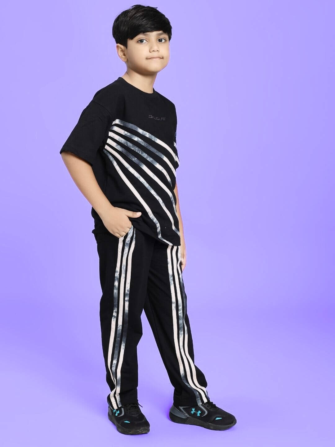 Child wearing FLICKER DESIGNER CO-ORD SET FOR BOYS GIRLS BLACK on purple background