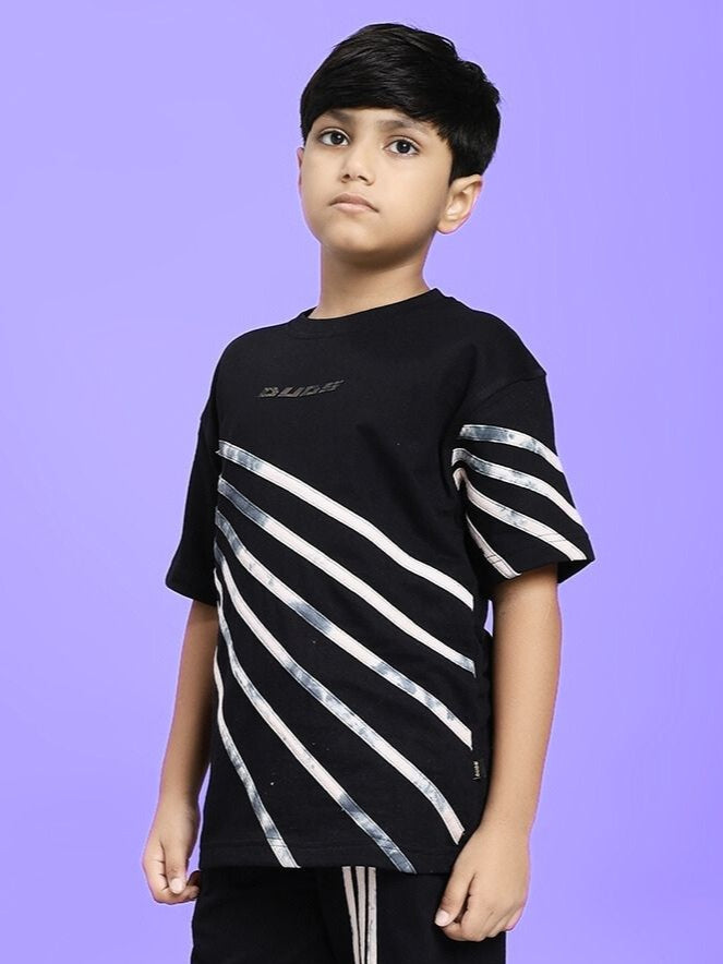 Child wearing FLICKER DESIGNER OVERSIZED T-SHIRT FOR BOYS AND GIRLS BLACK with stripe design on a purple background.