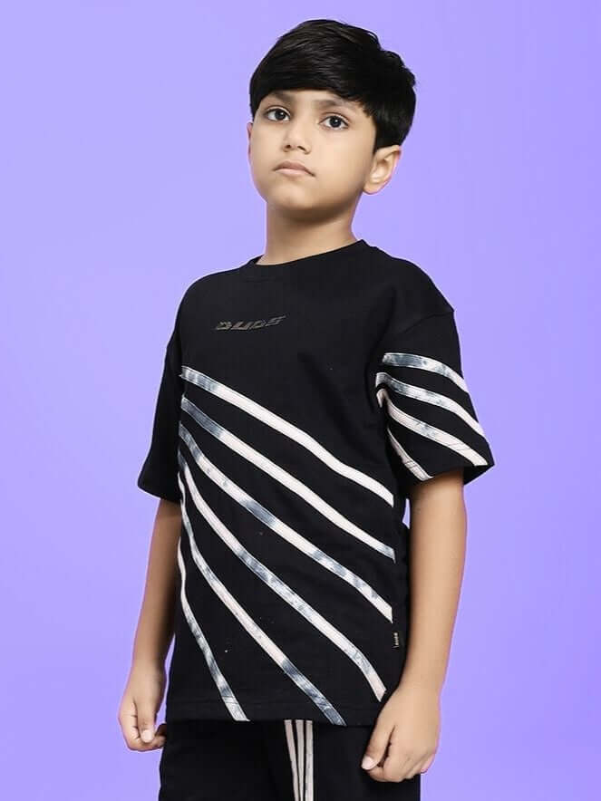 Child wearing FLICKER DESIGNER OVERSIZED T-SHIRT FOR BOYS AND GIRLS BLACK with stripe design on a purple background.
