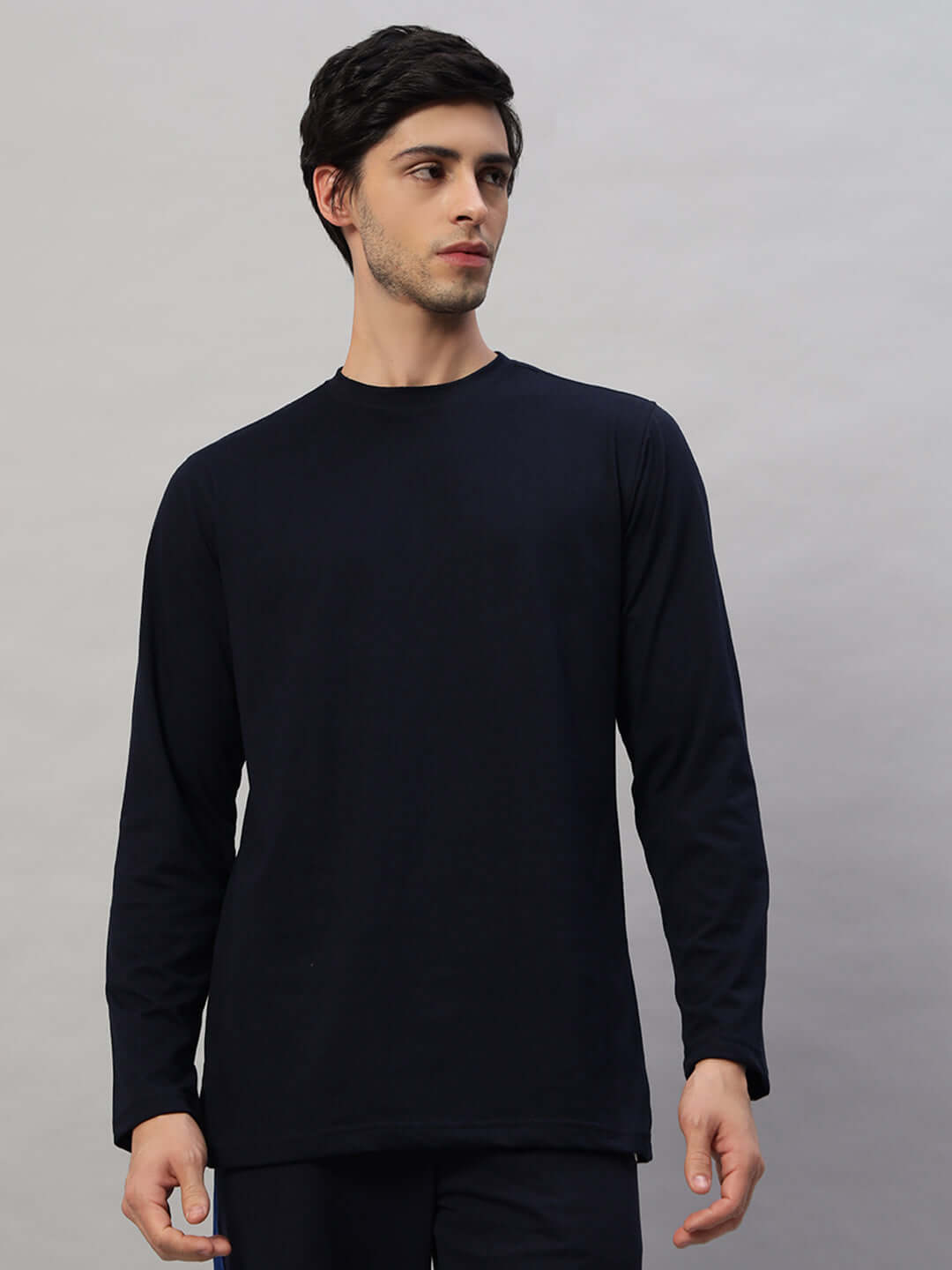 Man wearing navy blue Flimsy Slim Fit Sweatshirt, 100% cotton, bio-washed for softness, made in India. Perfect for casual wear.