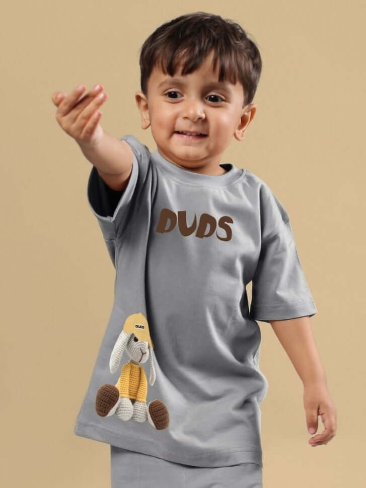 Child wearing FLINT BUNNY T-SHIRT FOR BOYS AND GIRLS GREY with a cute bunny design, perfect for kids' wardrobe.