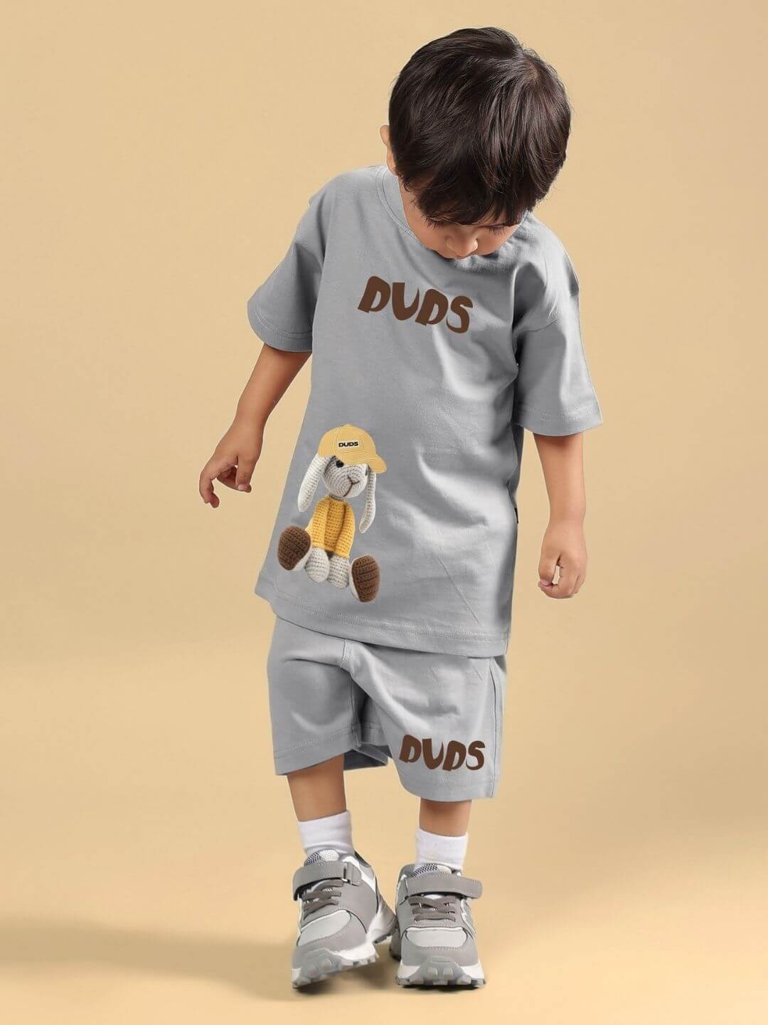 Child wearing FLINT BUNNY CO-ORD FOR BOYS AND GIRLS GREY, featuring bunny graphic on grey cotton-blend set.