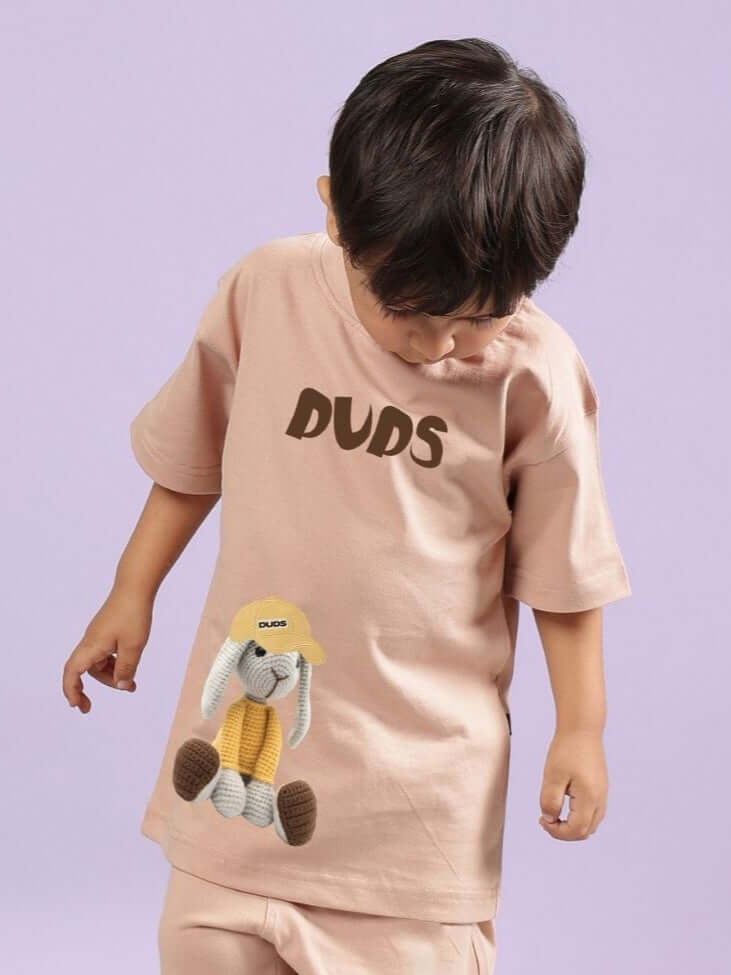 Young child wearing FLINT BUNNY T-SHIRT FOR BOYS AND GIRLS BEIGE