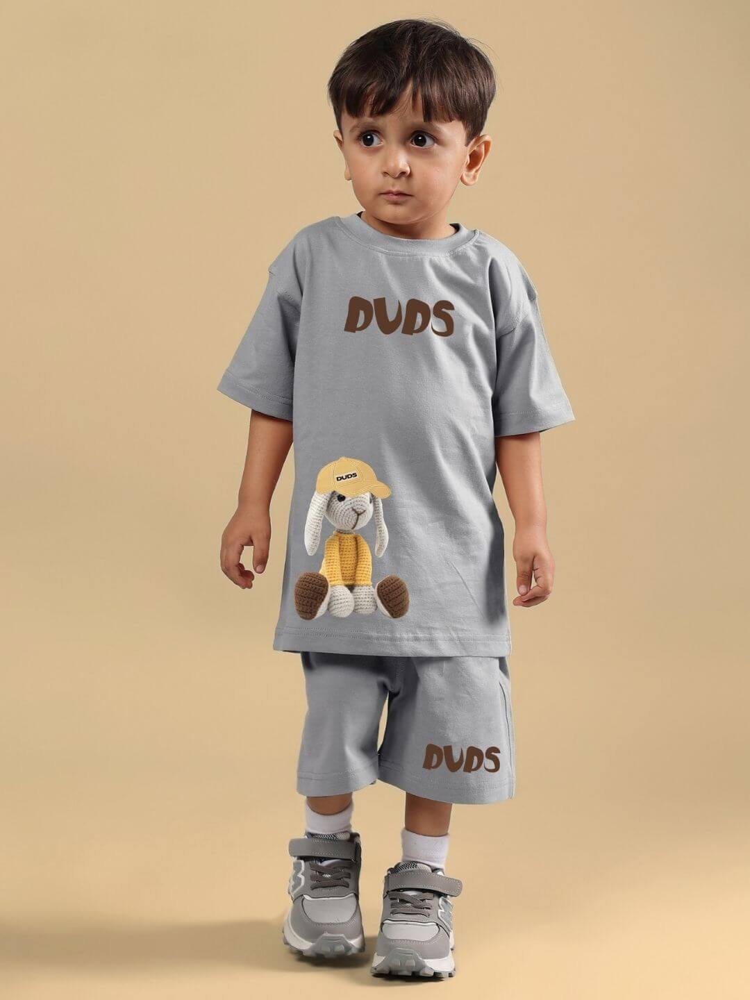 Child wearing Flint Bunny T-Shirt for Boys and Girls Grey, featuring playful design and soft cotton-blend fabric for comfort and durability.