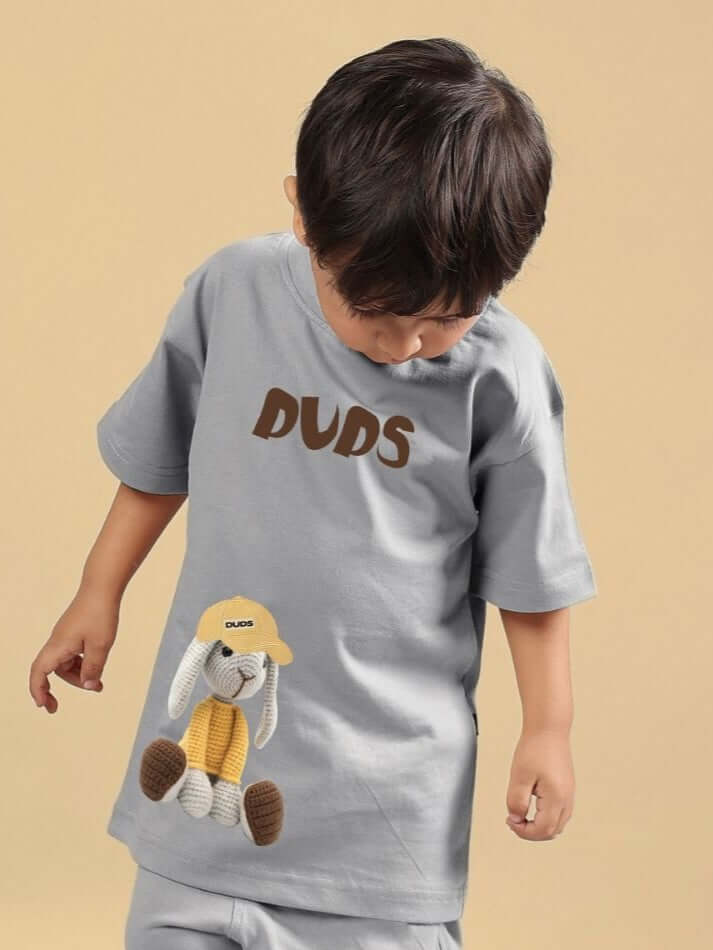 Child wearing FLINT BUNNY T-SHIRT FOR BOYS AND GIRLS GREY with playful design.