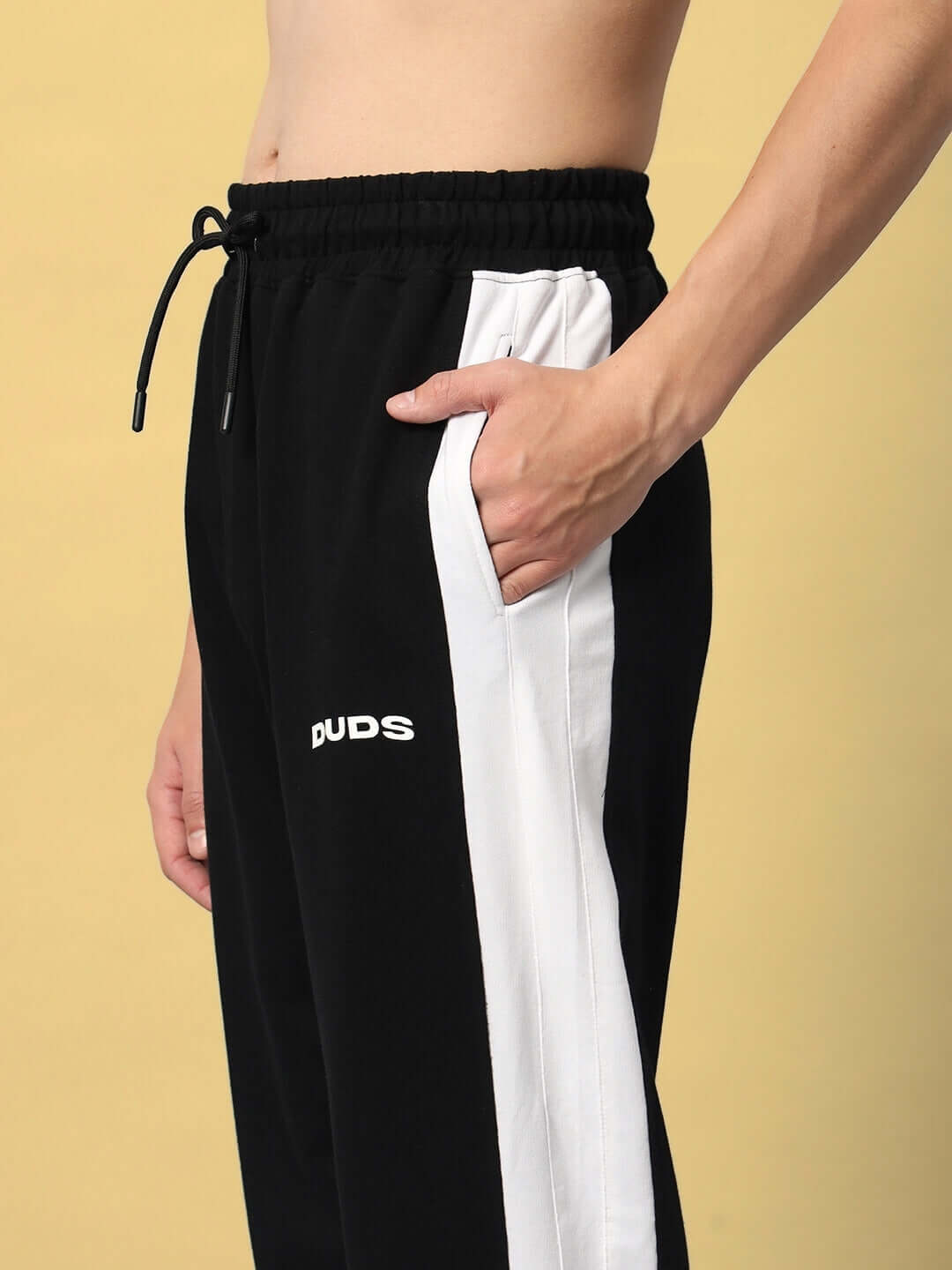 Black and white FLURRY CONTRAST JOGGERS by DUDS, featuring custom fit option and crafted by skilled tailors.