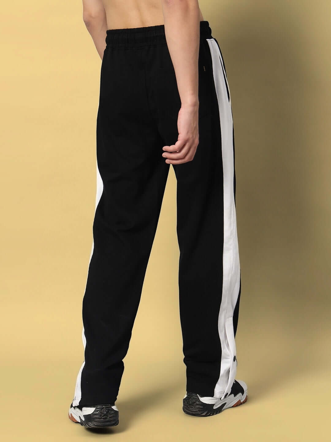 Back view of FLURRY CONTRAST JOGGERS in black and white, featuring a stylish design and comfortable fit.
