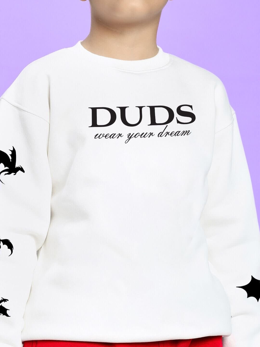 Child wearing FLY OR DIE DRAGON FLEECE CO-ORD FOR BOYS AND GIRLS WHITE RED with dragon graphics and text detail on the top