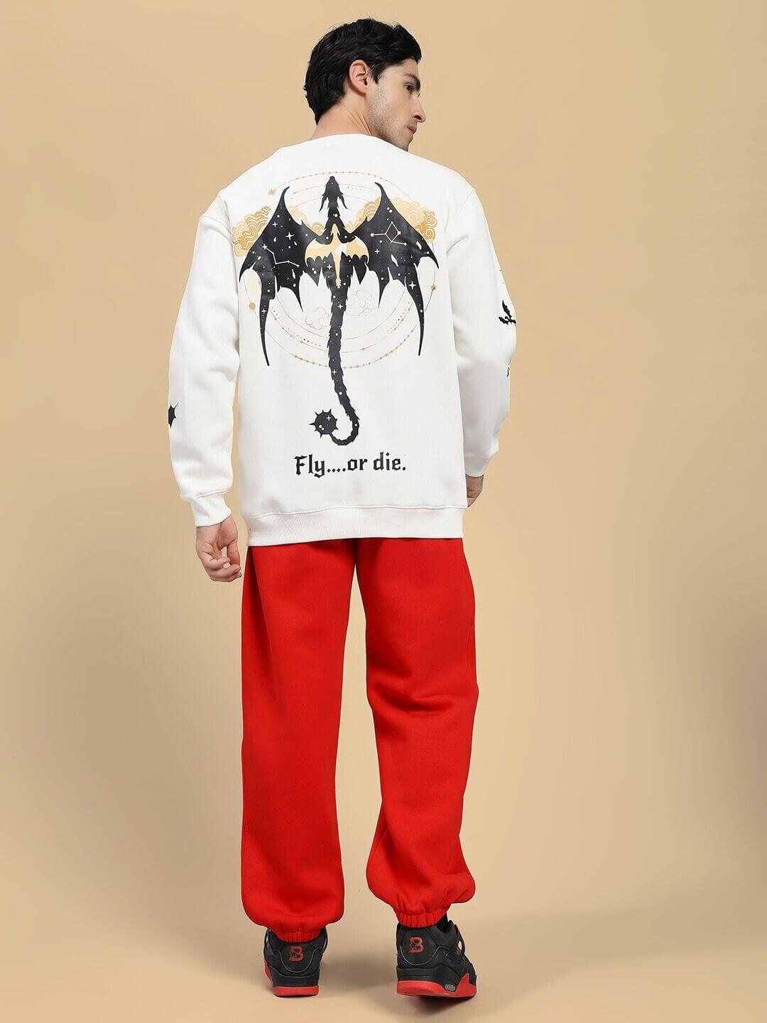 Model wearing FLY OR DIE DRAGON PRINT FLEECE CO-ORD SET OFF WHITE RED with dragon motif on back, showcasing streetwear style.