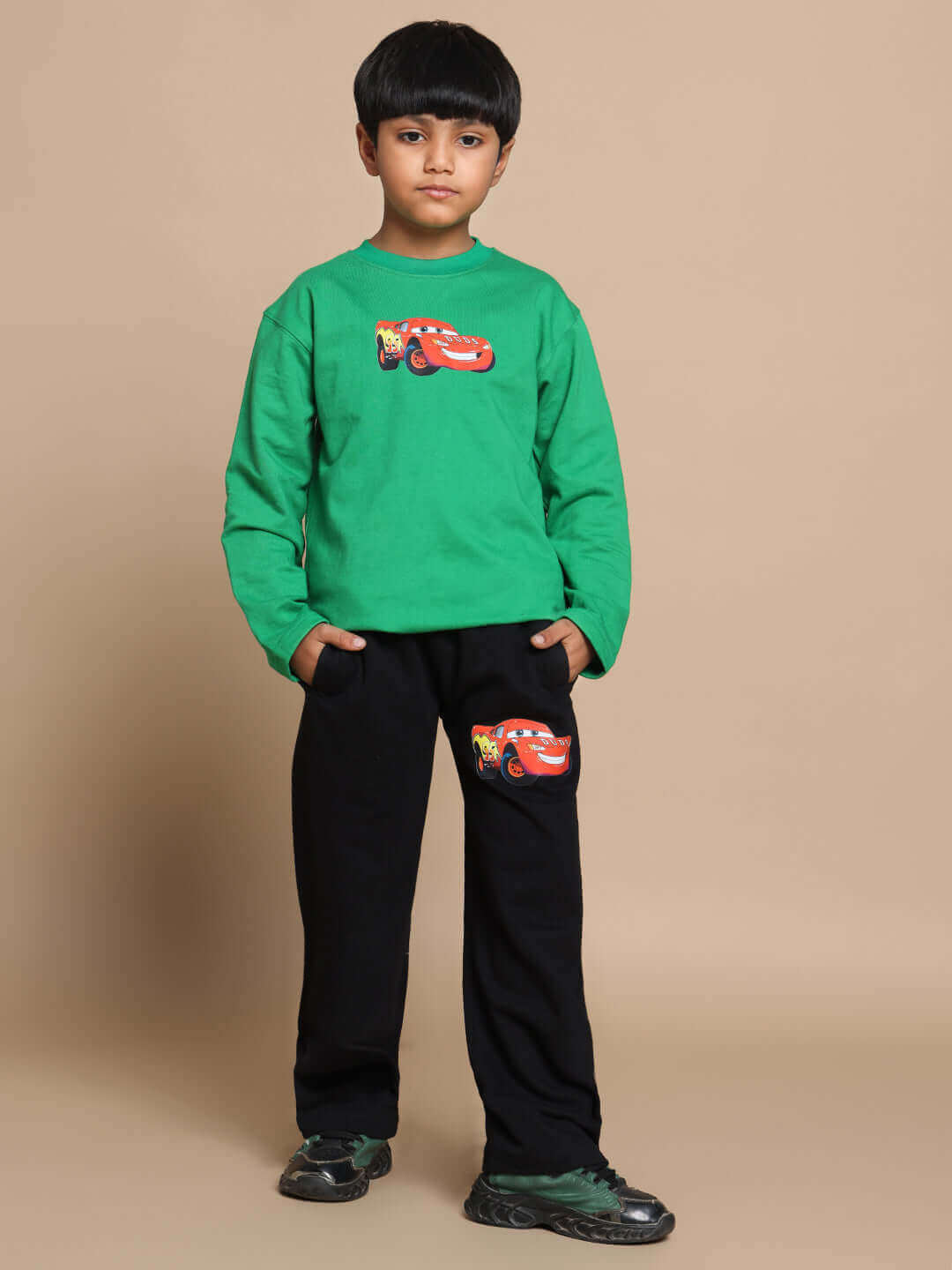Child wearing green-black Formula 1 co-ord set with car print, suitable for boys and girls. Made to order by DUDS.