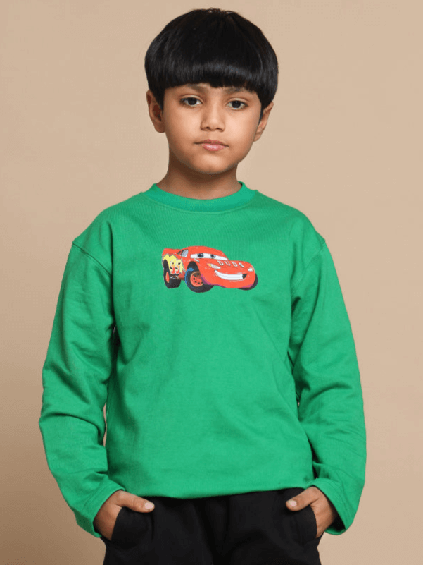 Boy wearing green Formula 1 oversized sweatshirt, featuring a vibrant car graphic, suitable for boys and girls. Made to order by DUDS.
