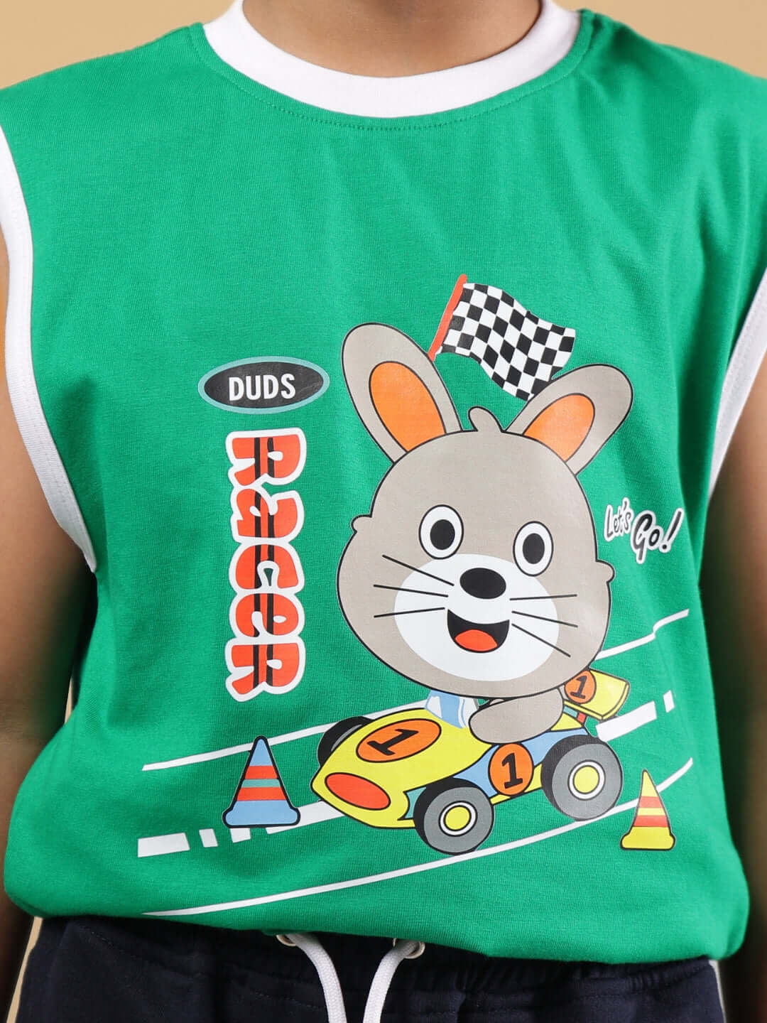 Child wearing FORZA T-SHIRT FOR BOYS & GIRLS GREEN featuring cartoon racer print.
