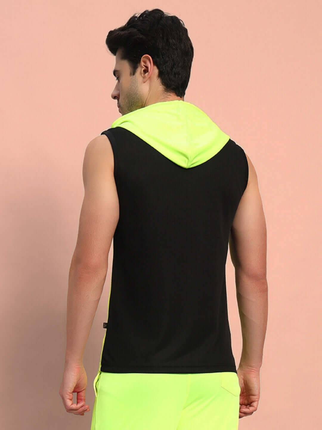 Back view of a person wearing the FRANKY GYM POLYESTER T-SHIRT NEON GREEN, showcasing a vibrant activewear design.