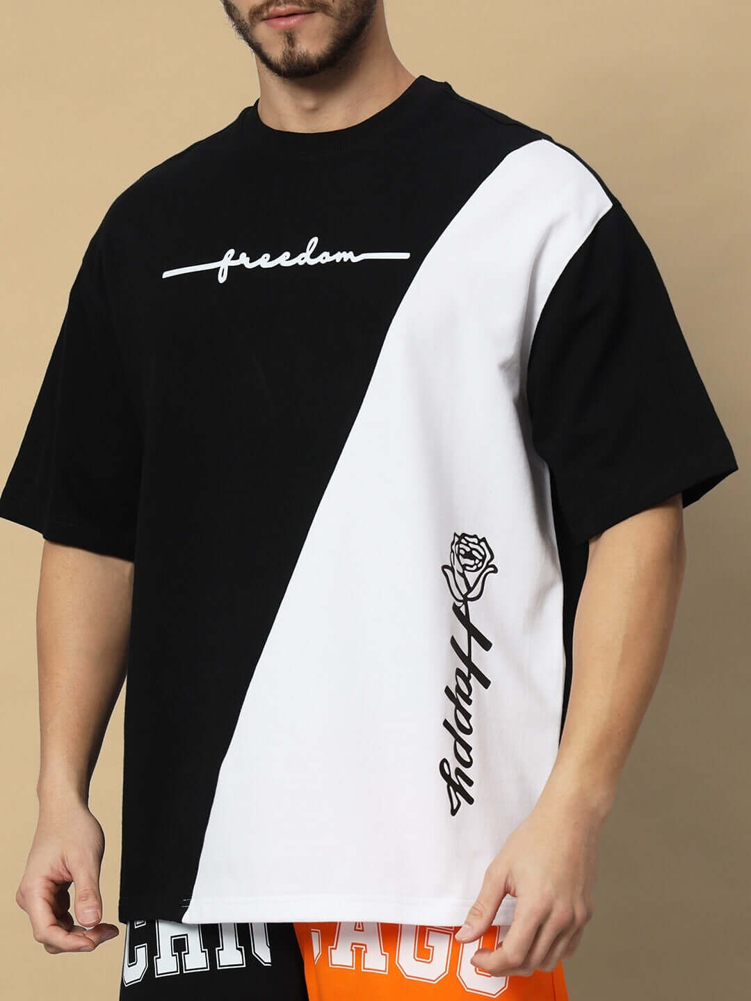 Model wearing freedom contrast black-white oversized T-shirt, premium cotton, bio-washed, from Color By. Country of Origin: India.