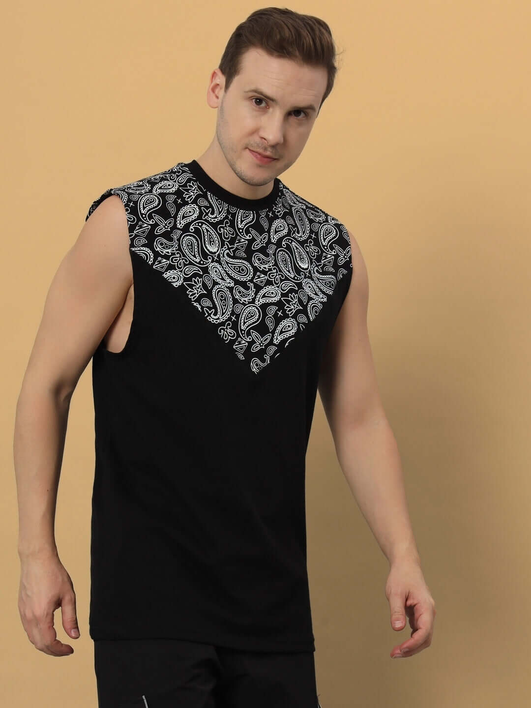 Black oversized sleeveless T-shirt with paisley design, made from premium cotton French terry, perfect for stylish casual wear.