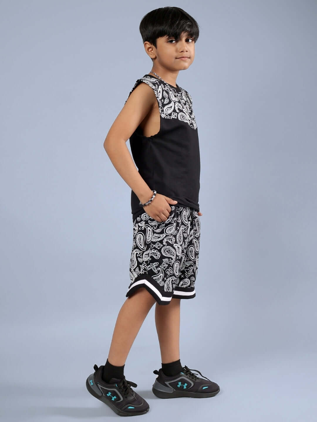 Child wearing FREESTYLER CO-ORD FOR BOYS & GIRLS BLACK with patterned shorts and sleeveless top.