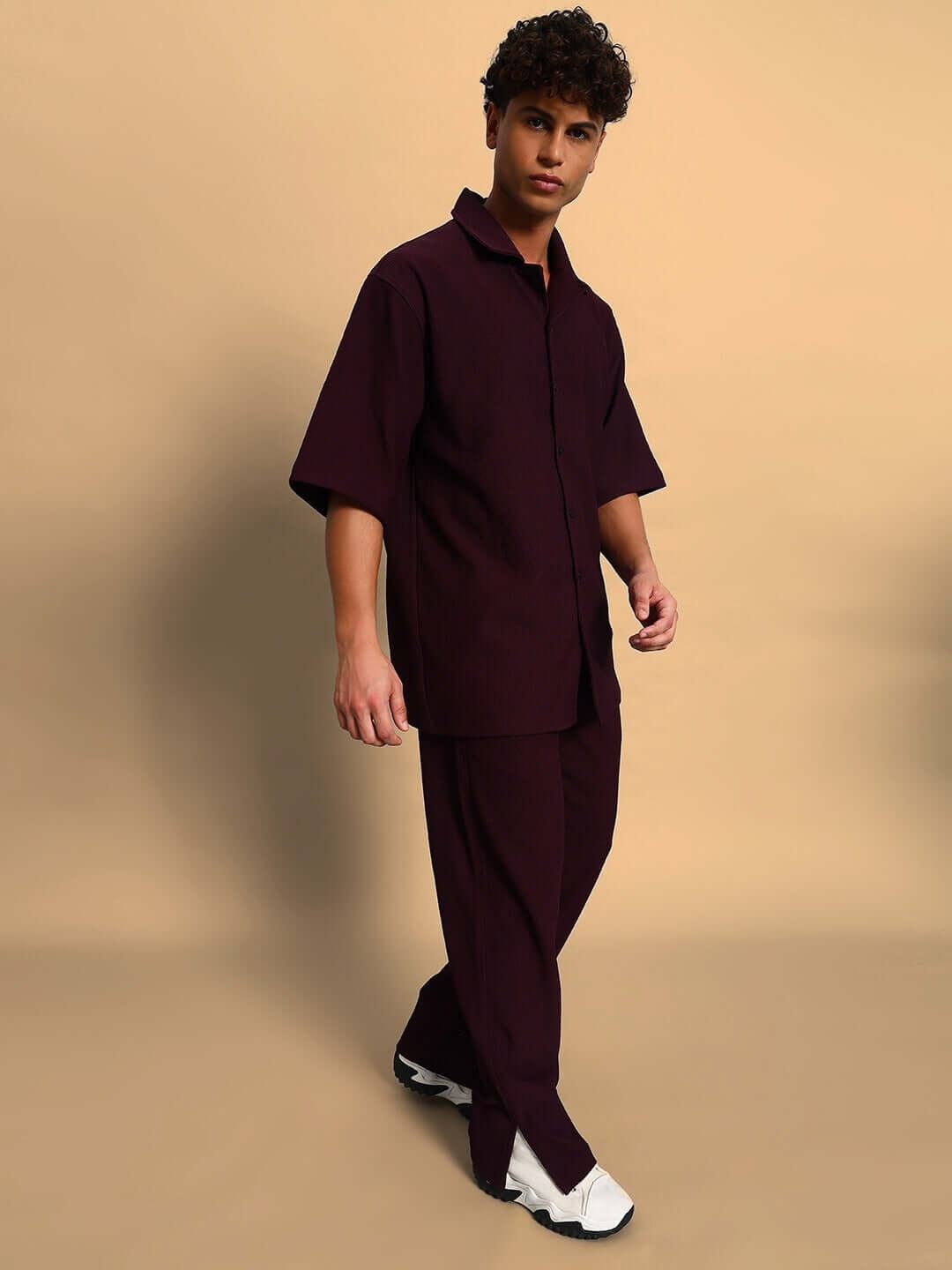 Model wearing FROWZY CO-ORD SET RIBBED LYCRA WINE, showcasing the superior stretch and wrinkle resistance of the fabric.
