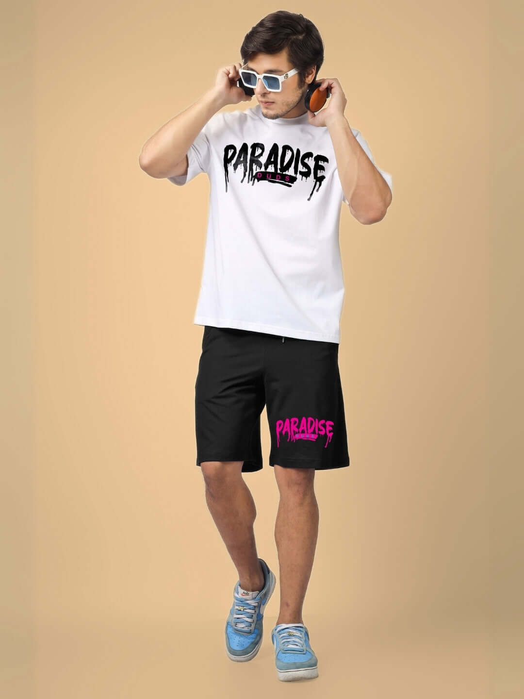 Man wearing FULNESS PARADISE CO-ORD SET WHITE BLACK with "PARADISE" text print, showing bold streetwear style for casual outings.