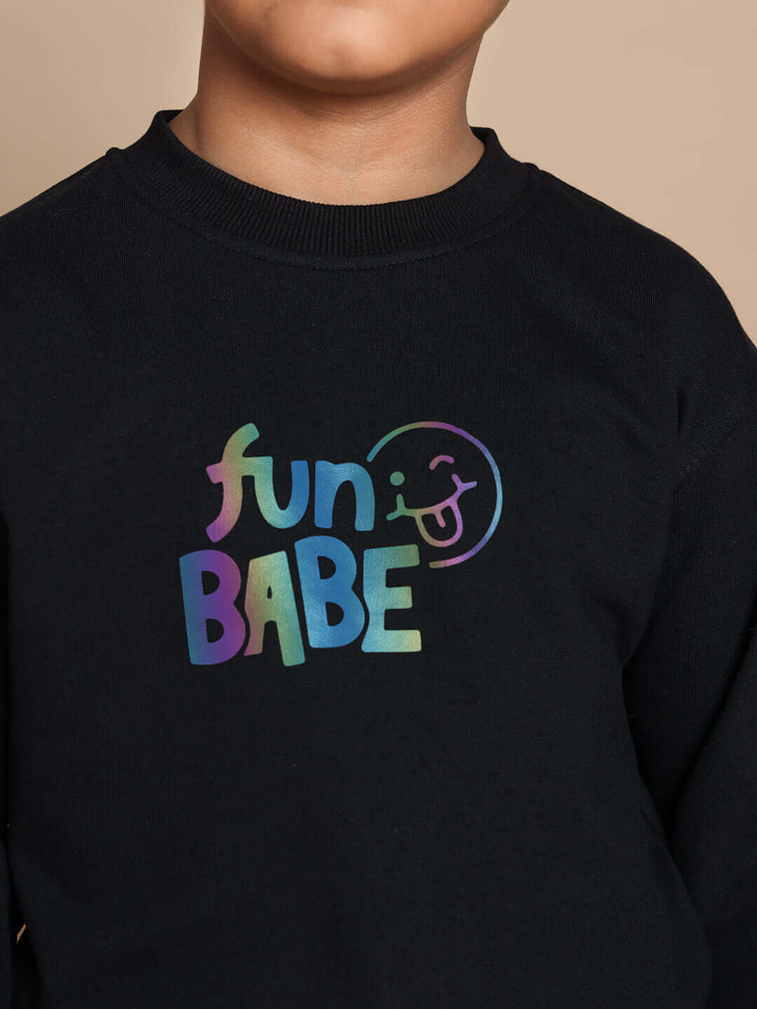 Child wearing black FUN BABE co-ord sweater, unisex outfit with colorful lettering, ideal for both boys and girls.