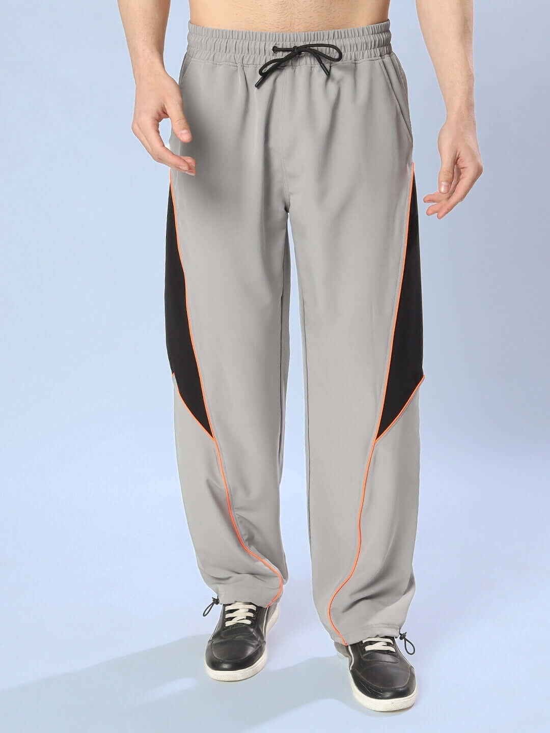 Grey relaxed fit cargo pants with drawstring waist, customizable size, highlighted by black and orange accents.