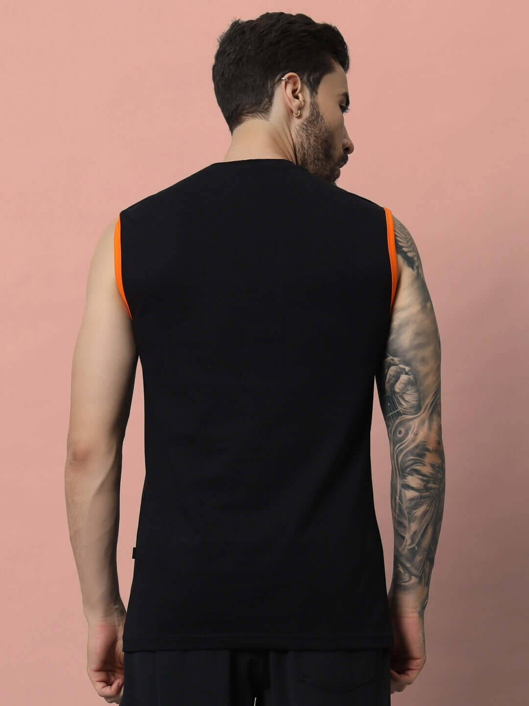 Back view of man wearing a black FUTURE GYM T-SHIRT, showcasing customized fit, perfect for fitness enthusiasts. DUDS handmade design.