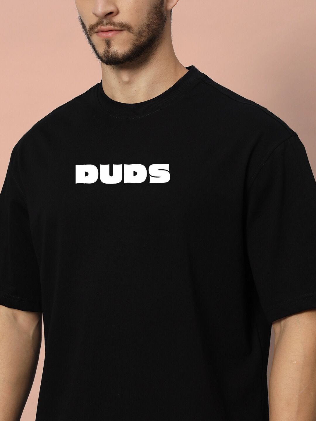 Model wearing GAME-OVER OVER-SIZED T-SHIRT BLACK with bold white logo