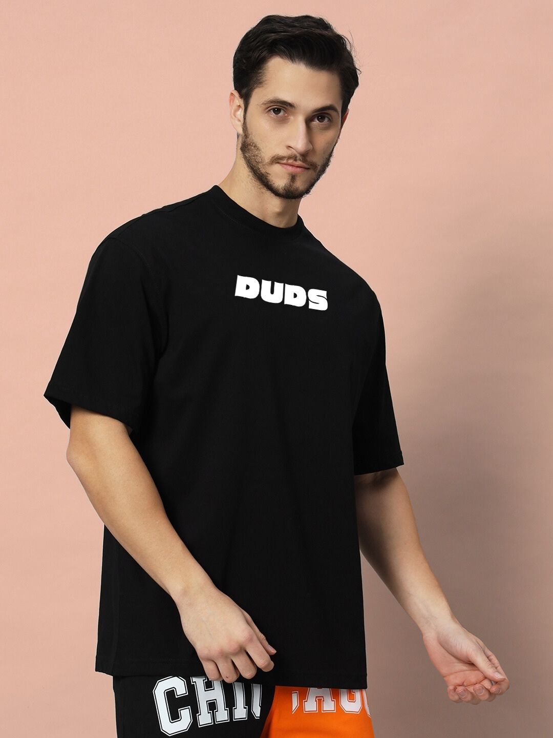 Model wearing GAME-OVER OVER-SIZED T-SHIRT BLACK with casual style.