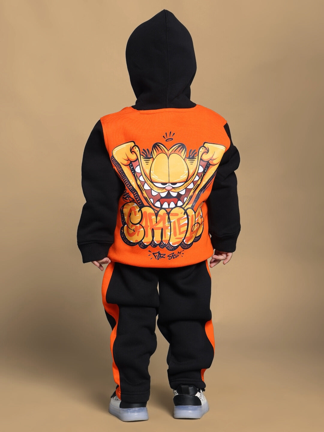 Child wearing COOL TEDDY FLEECE PANT FOR BOYS GIRLS BLACK ORANGE with playful design, perfect for active, stylish comfort.