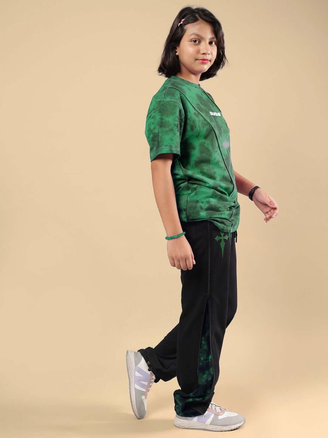 Child wearing GHOST RIDER CO-ORD FOR BOYS & GIRLS GREEN BLACK, showcasing stylish comfortable fashion, perfect for both boys and girls.