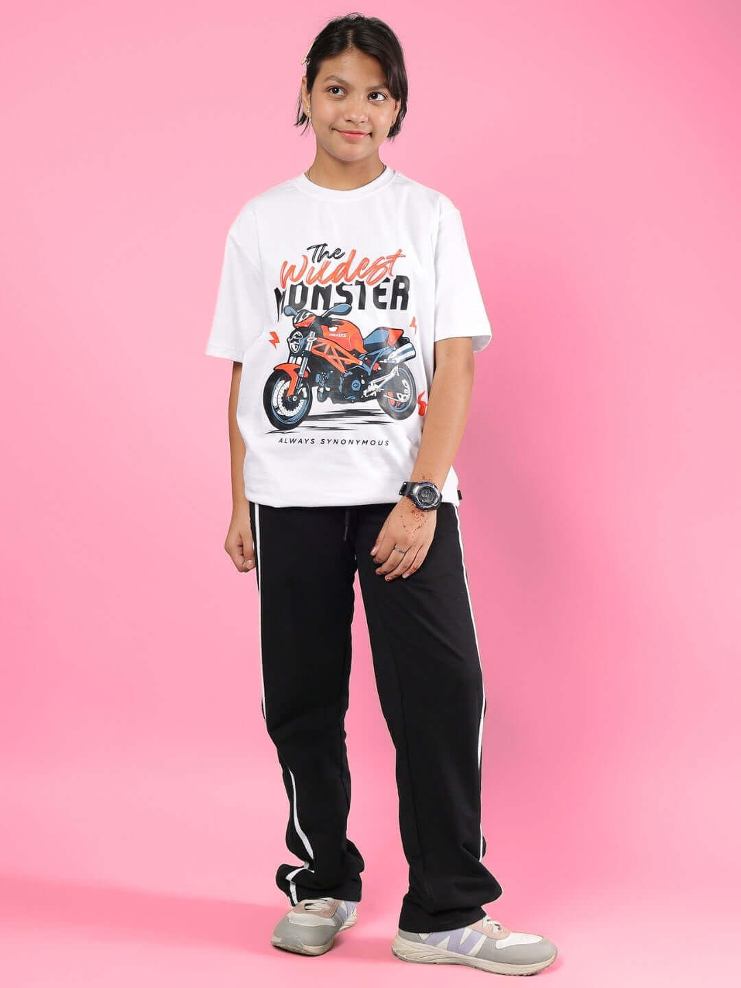 GIXXER CO-ORD FOR BOYS & GIRLS WHITE-BLACK outfit on a child with a graphic tee and black pants, pink background