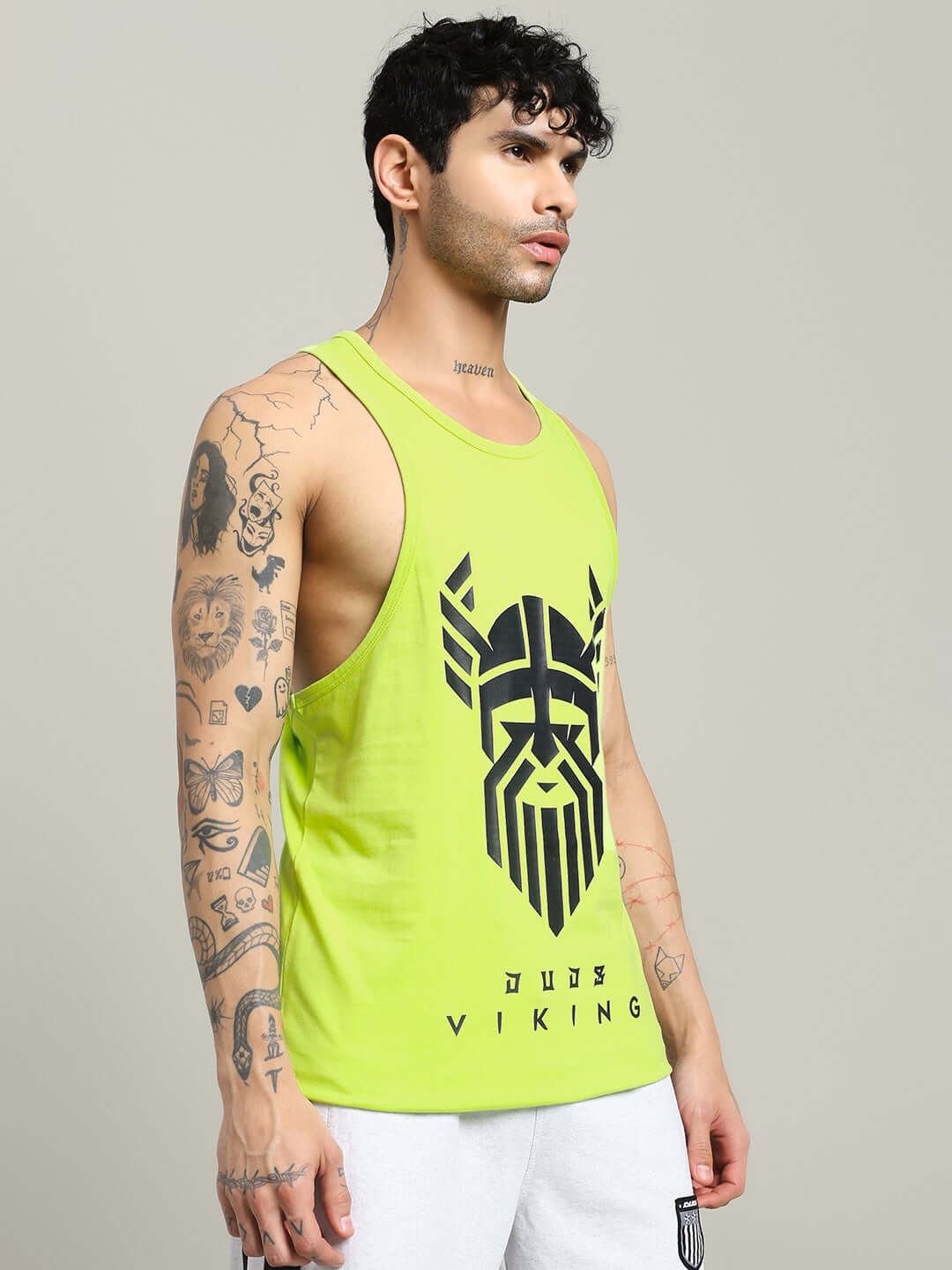 Man wearing neon green Gladiator Gym T-shirt featuring a bold Viking design, ideal for workouts and casual wear.