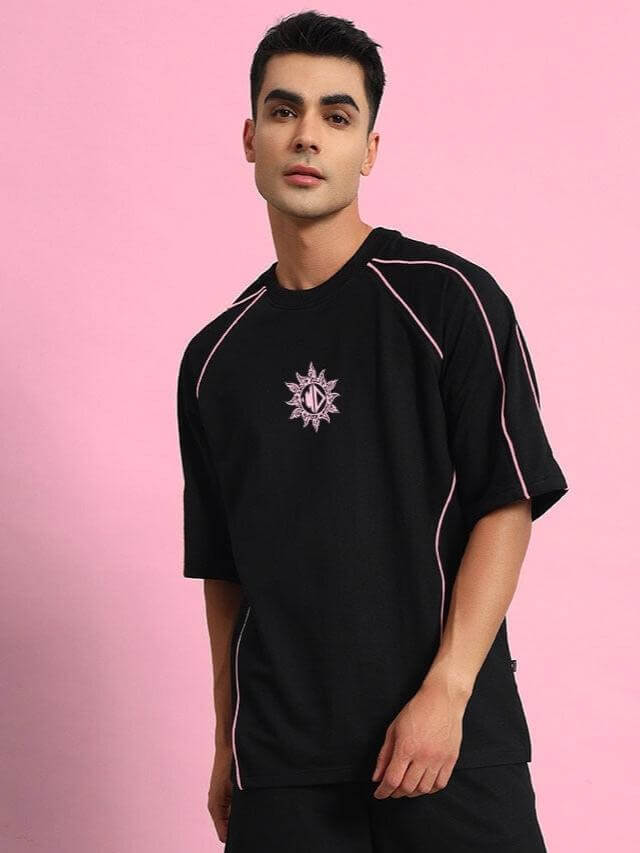 Model wearing GLARE co-ord set in black with premium cotton French terry lycra, featuring stylish design, perfect for casual wear.