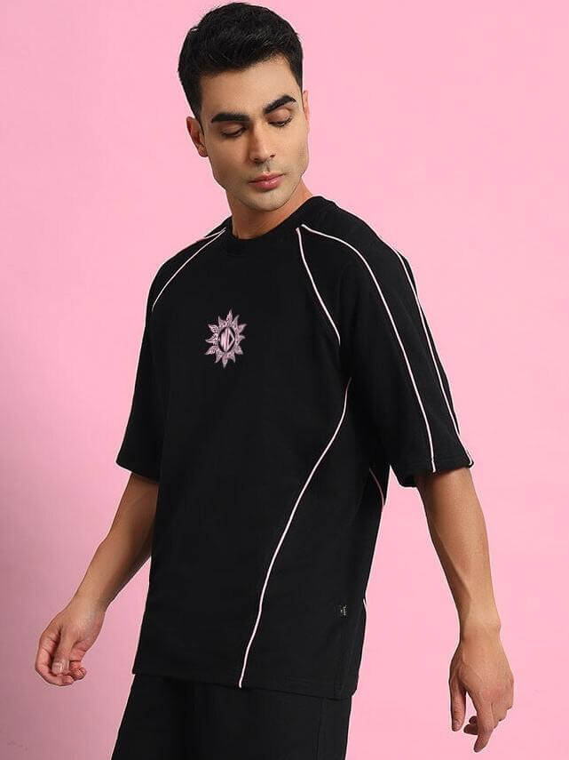 Model wearing GLARE CO-ORD SET in black; premium cotton French Terry Lycra fabric; stylish and comfortable fashion outfit.