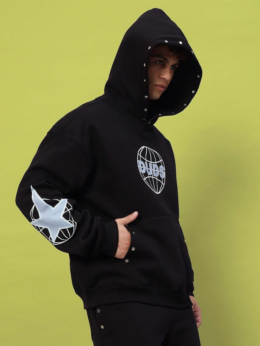 Model wearing GLOBAL COTTON FLEECE CO-ORD BLACK hoodie, showcasing urban streetwear style with modern design and premium cotton fleece material.