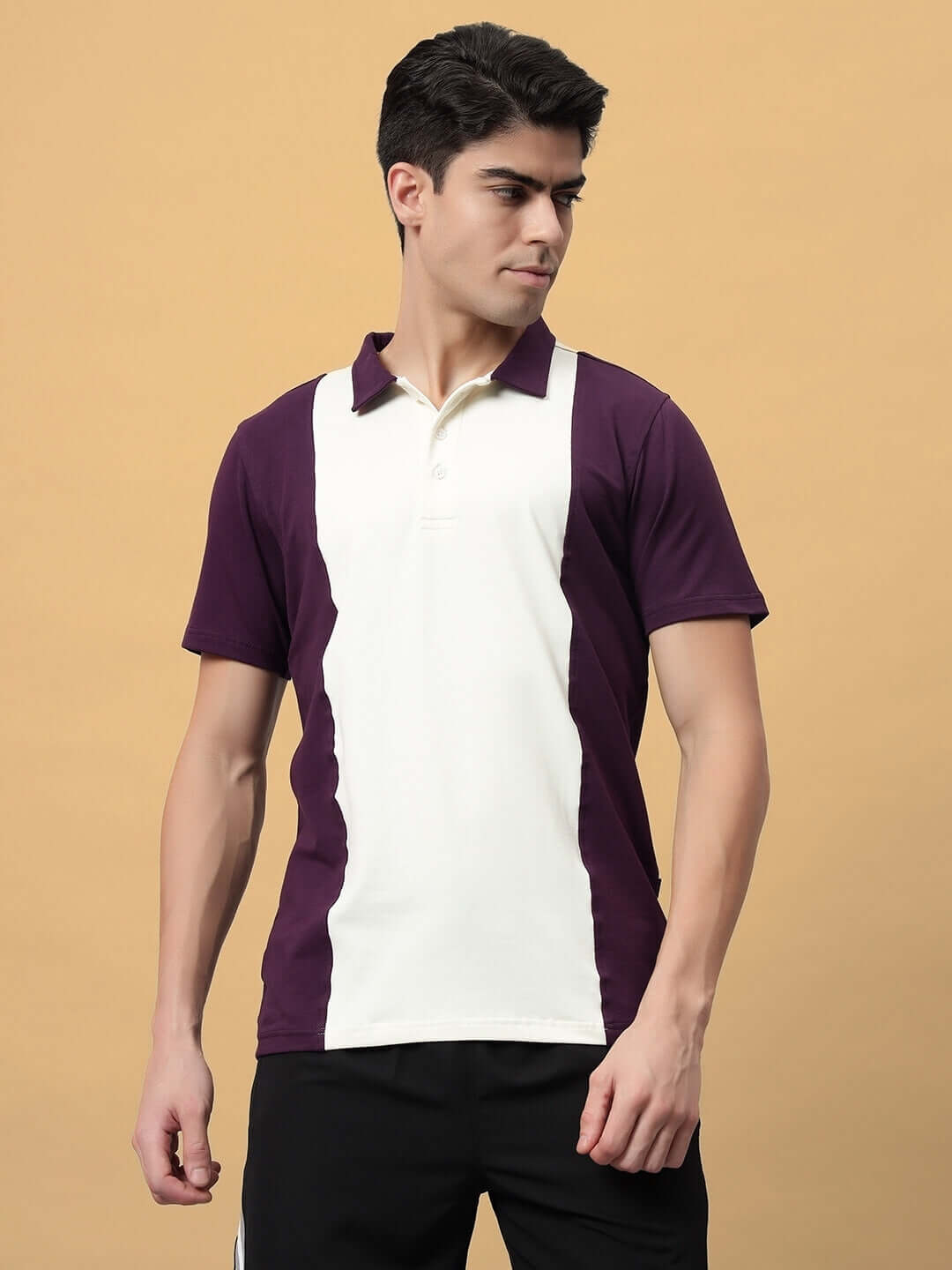Man wearing GLORY REGULAR FIT T-SHIRT PURPLE-OFF WHITE with colorblock design and comfortable fit.