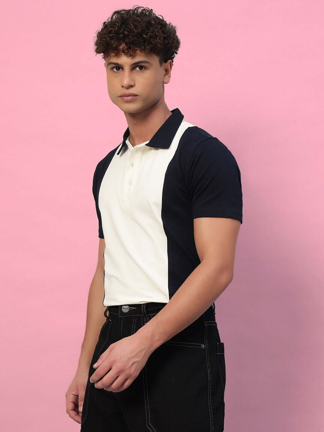 Man wearing GLORY REGULAR FIT T-SHIRT NAVY BLUE against pink background.