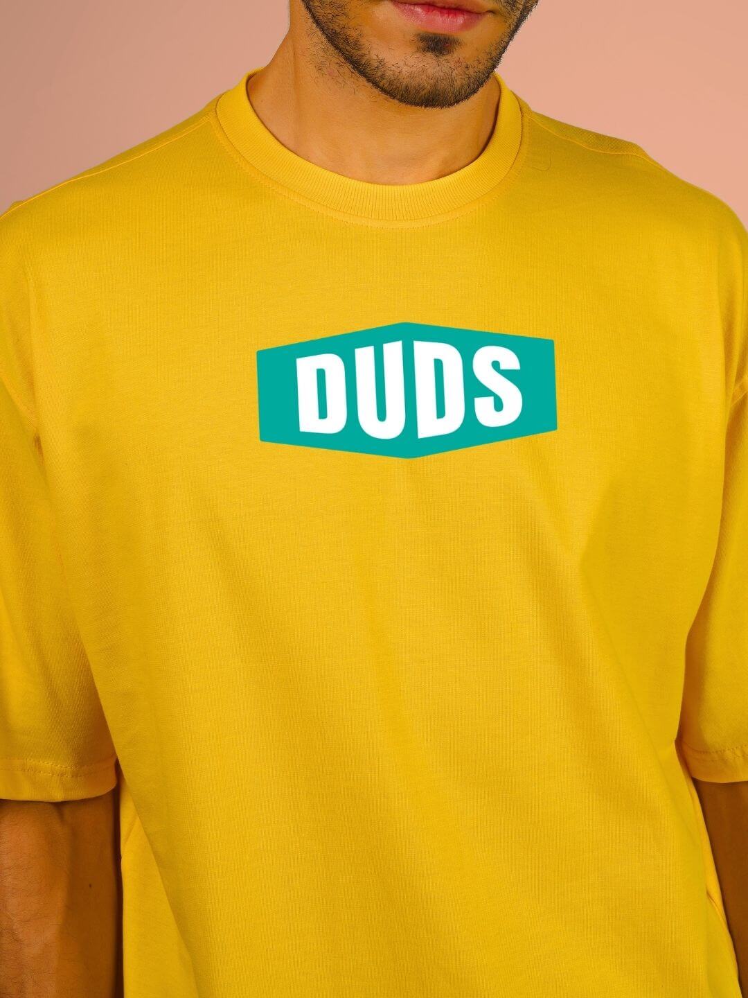 GO WILD ADVENTURE OVER-SIZED T-SHIRT YELLOW with "DUDS" logo displayed on front