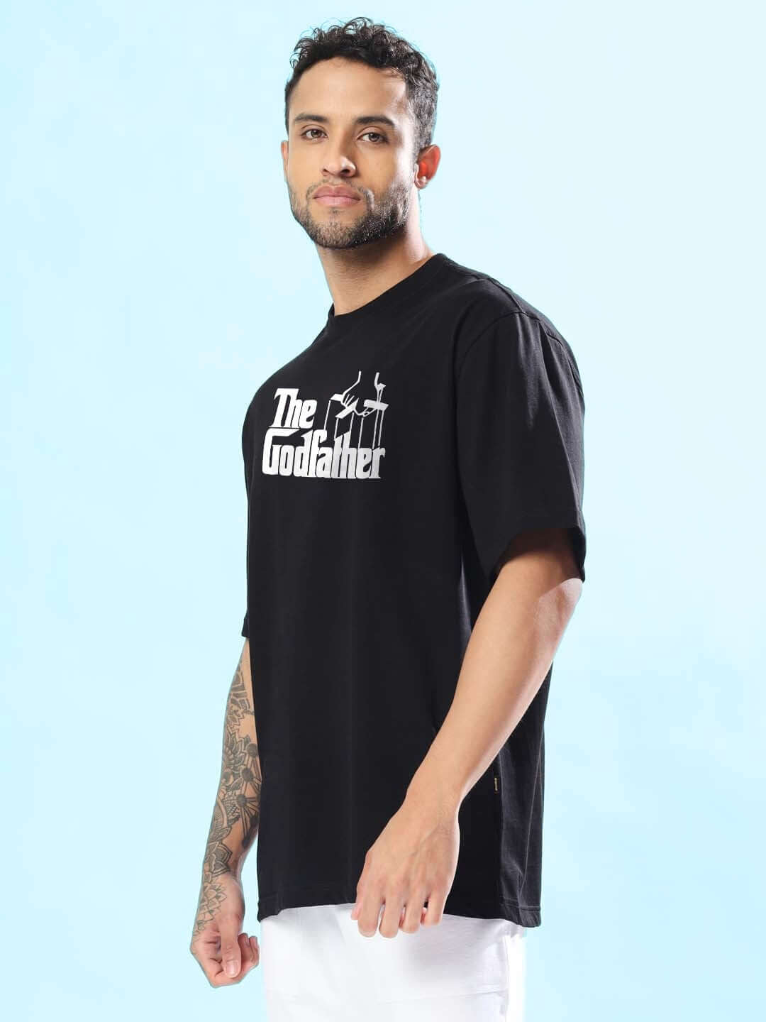 Model wearing The Godfather oversized black T-shirt, available with custom fit option for prepaid orders, handmade by DUDS.