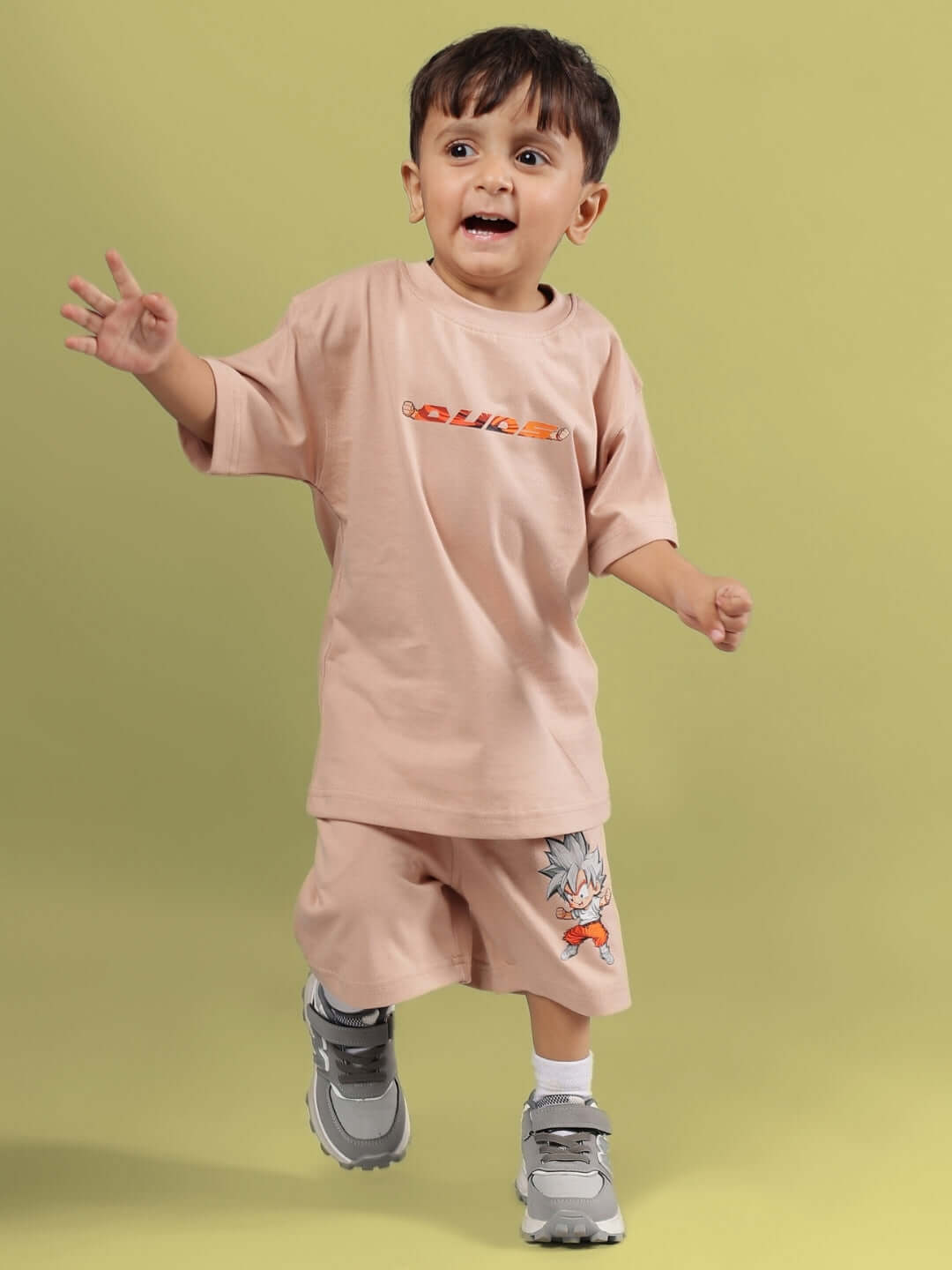 GOHAN SUMMER CO-ORD FOR BOYS & GIRLS BEIGE - Child wearing a beige co-ord set featuring playful design, made to order with custom fit option.