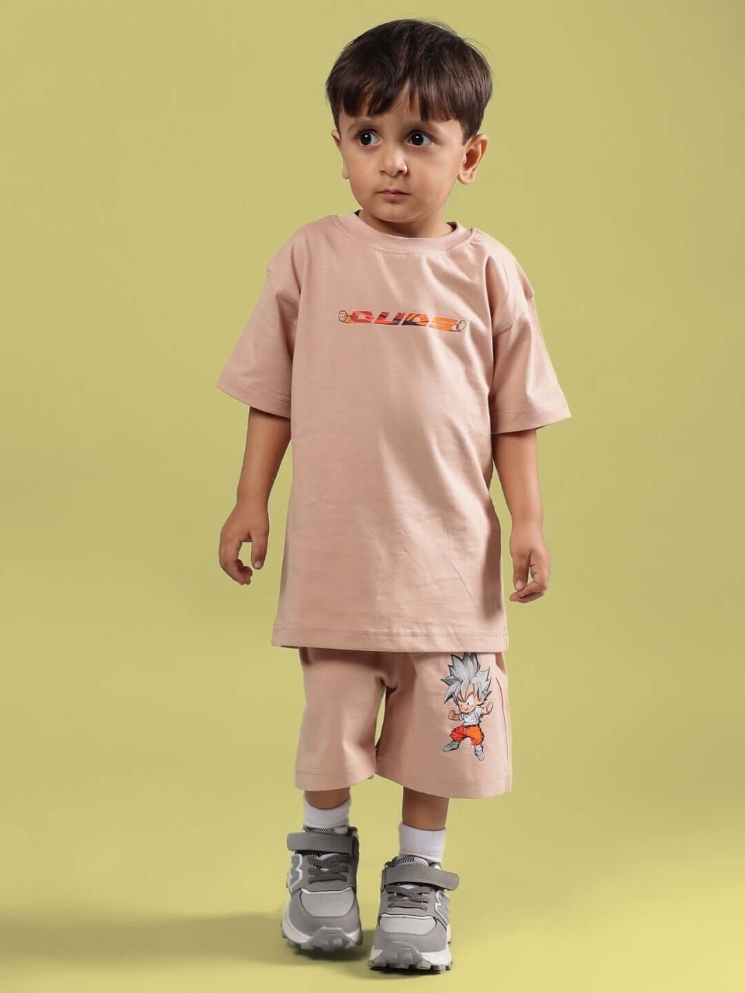 GOHAN SUMMER CO-ORD FOR BOYS & GIRLS BEIGE outfit modeled by child, featuring beige T-shirt and shorts with character design.