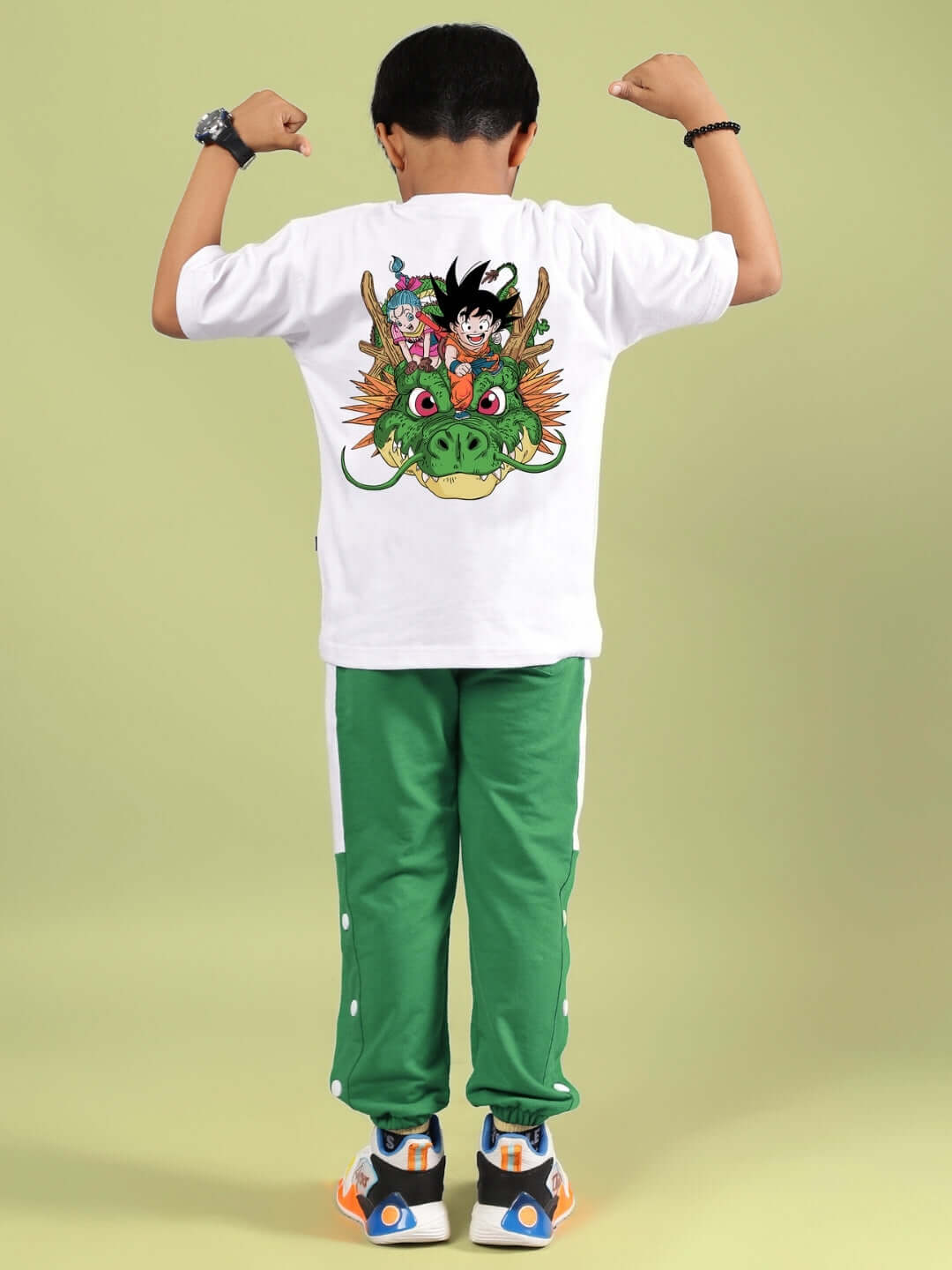 Child wearing Goku and Bulma printed white-green co-ord, showcasing back design, made by DUDS.