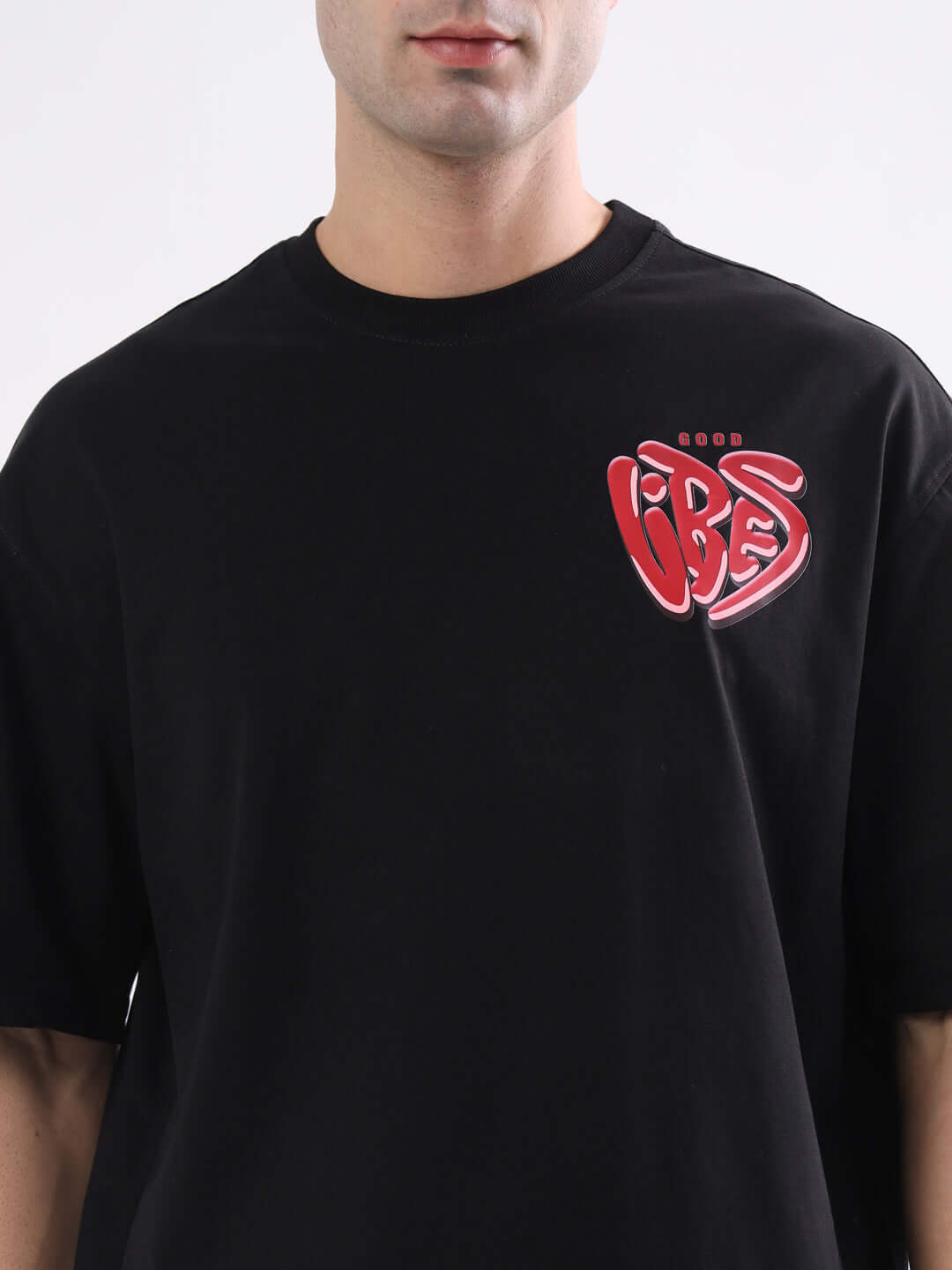 Black over-sized t-shirt with 'Good Vibes' logo, available in custom fit for prepaid orders.