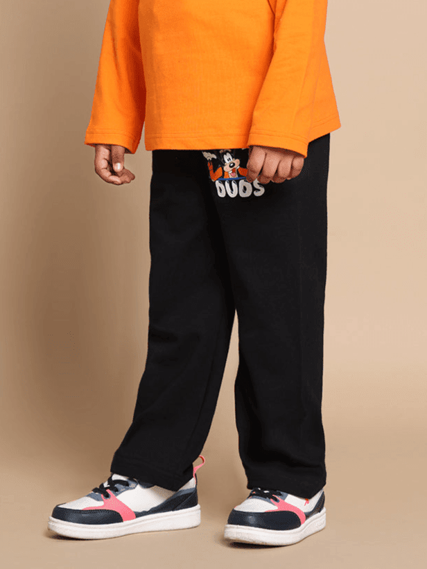 Child wearing the GOOFY CO-ORD SET FOR BOYS GIRLS ORANGE BLACK with orange top and black joggers, showcasing playful fashion style.